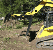 CL Fabrication Skid Steer Grapple Rack in use with open jaw