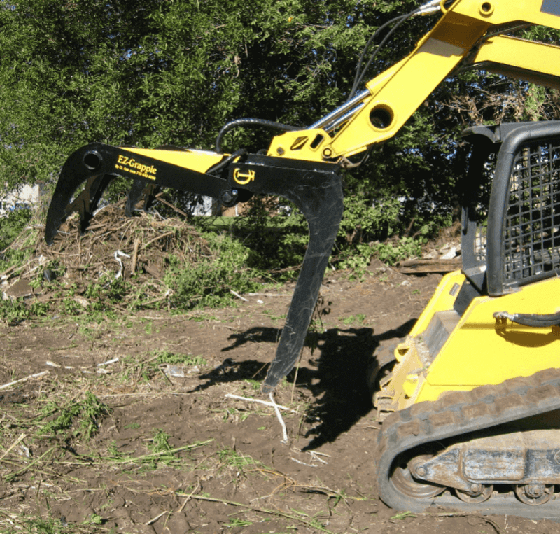 CL Fabrication Skid Steer Grapple Rack in use with open jaw